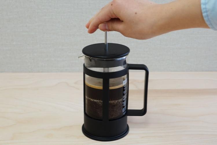 push the filter slowly to the bottom.